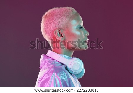 Cyberpunk headphones, black woman and fashion in studio, holographic beauty and vaporwave clothes. Futuristic model, young gen z and listening to music with neon aesthetic, audio technology and face 商業照片 © 
