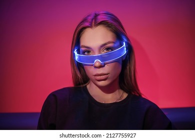 Cyberpunk Style Night Portrait Photography, Woman In Glasses, Android Robot Cyborg Woman, In Futuristic Cyberpunk Fashion Costume Sci Fi Tech Outfit, Neon Noir Concept Art Female. High Quality Photo