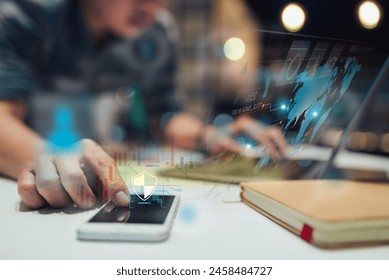 A cybersecurity analyst examines digital security data on a smartphone, surrounded by holographic data charts. - Powered by Shutterstock