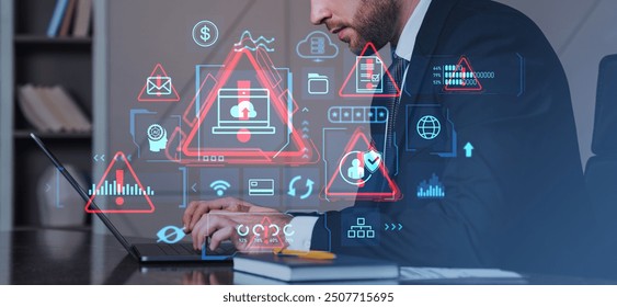 Cybersecurity analyst working on a laptop surrounded by digital warning icons and graphs, in a modern office setting, highlighting data security and risk analysis