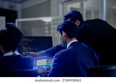 Cybersecurity analysts executing threat mitigation protocols in security operations center. IT specialists monitoring network firewall intrusion detection.