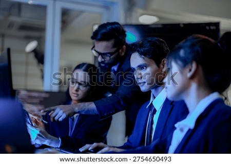 Cybersecurity analysts executing threat mitigation protocols in security operations center. IT specialists monitoring network firewall intrusion detection.