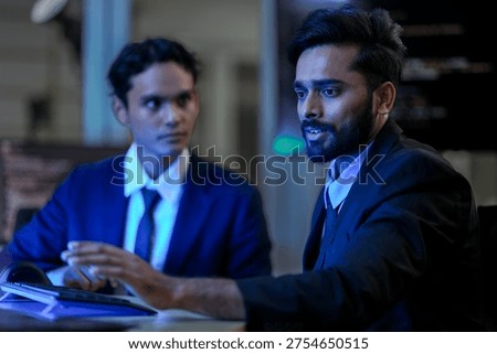 Cybersecurity analysts executing threat mitigation protocols in security operations center. IT specialists monitoring network firewall intrusion detection systems.