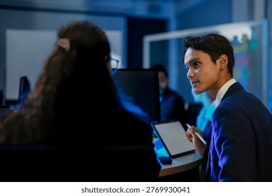 Cybersecurity analysts mitigating network intrusion threats in blue team SOC. Digital forensic experts executing firewall vulnerability protocols at night.