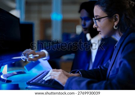Cybersecurity analysts mitigating network intrusion threats in blue team SOC. Digital forensic experts executing firewall vulnerability protocols at night.