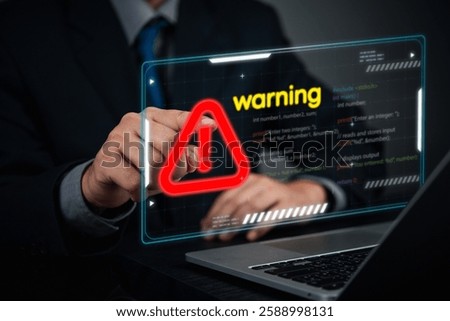 Cybersecurity coding warning concept. businessman pointing screen red alert sign, cyber threats, hacking risks, and system vulnerability. Digital security breach warning futuristic online threats.