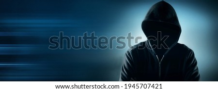 Cybersecurity, computer hacker with hoodie