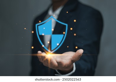 cybersecurity concept. Businessman holding shield protect icon Cybersecurity privacy of data protection .Protection network security computer and secure your data concept .