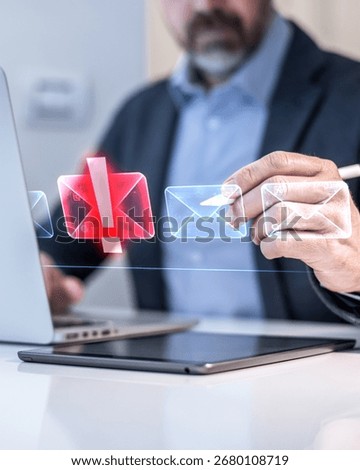 Cybersecurity concept: A businessman using a virtual interface to filter malicious spam and phishing emails