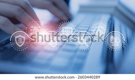 Cybersecurity concept. Hands typing on a keyboard with a digital overlay of cybersecurity icons, including locks, shields, and cloud protection, data privacy, online safety and network security.