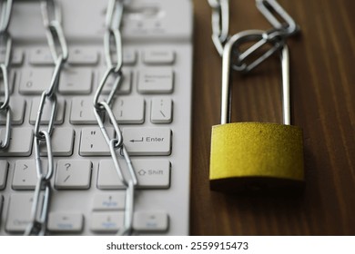 Cybersecurity Concept: Locked Keyboard with Chain and Padlock on Wooden Surface