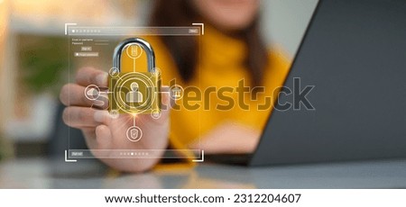 Cybersecurity concept. A person is holding onto a padlock containing a data privacy protection system from digital threats. Protect hardware, software and applications connect to work on the Internet.