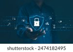 Cybersecurity Concept. A person holds a smartphone displaying a shield with a lock symbol, surrounded by various cyber security icons, representing user privacy, and data encryption. Secure technology