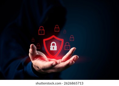 Cybersecurity concept with red shield and padlock icon in hand. Represents data protection, internet security, and digital privacy for defense, encryption, and firewall solutions.