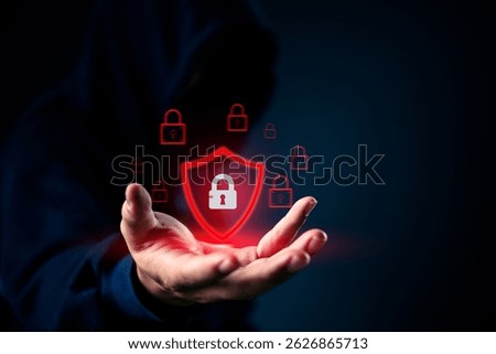 Cybersecurity concept with red shield and padlock icon in hand. Represents data protection, internet security, and digital privacy for defense, encryption, and firewall solutions.