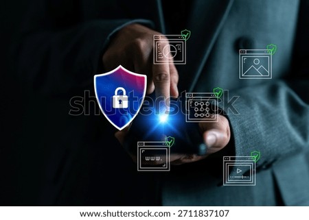 Cybersecurity concept showing hand using smartphone with digital shield icon and secure website elements. Data privacy, protection, internet safety, and secure communication technology.