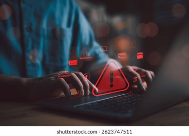 Cybersecurity concept showing warning alert on laptop screen, symbolizing data breach, hacking attack, and online threats in digital business environment.