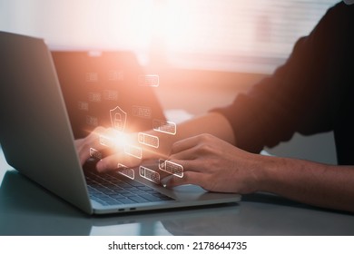 Cybersecurity concept,businessman using laptop computer, identification access personal,shield and padlock,preventing website attack hacker attack information,Ai Artificial intelligence technology
