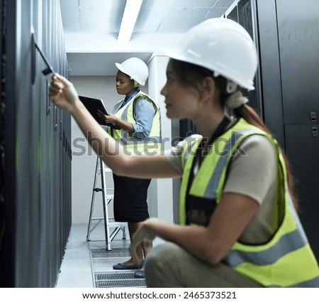 Cybersecurity, database and server room with engineer women at work to maintain computer network. Checklist, documents and repair with technician people working to install firewall on mainframe