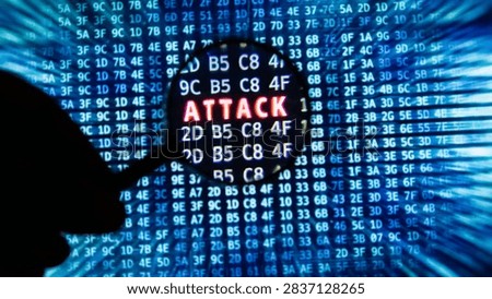 Cybersecurity defense system finding server hack threat, magnifying glass highlighting red attack text on blue digital code monitor.