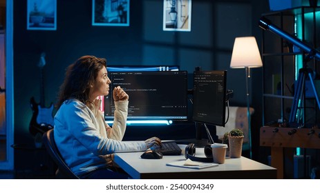 Cybersecurity expert using computer and augmented reality to look for company security vulnerabilities and injected malware. Programmer installing code on PC, looking at AR visualization, camera A