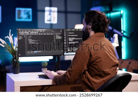 Cybersecurity expert using computer to look for company security vulnerabilities and injected malware. Programmer installing fortified code on PC to prevent cyber attacks