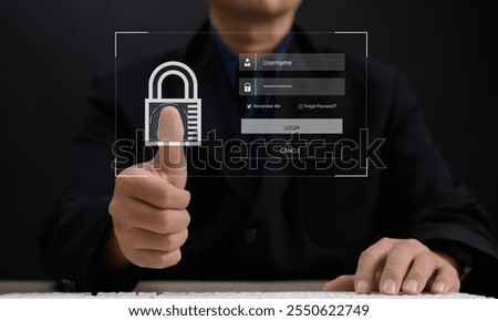 cybersecurity or internet access security concept : Business man use his finger to touching or pressing the virtual screen to lock or unlock important data on laptop using computer security system...