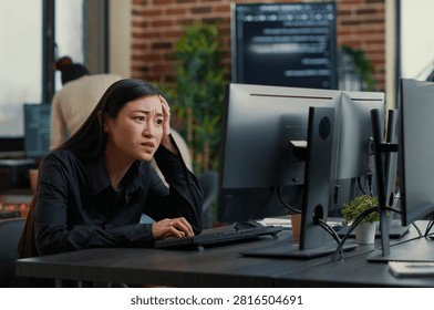 Cybersecurity Programmer Encountering System Failure at a software development desk, showing coding error, system failure and algorithm debugging during programming work.