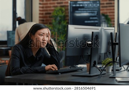Cybersecurity Programmer Encountering System Failure at a software development desk, showing coding error, system failure and algorithm debugging during programming work.