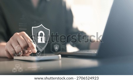 cybersecurity, security, A person using a mobile device with a digital lock shield icon, representing cybersecurity, data protection, encryption, and secure access in modern digital environments.