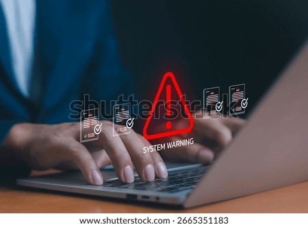 Cybersecurity system warning alert with red exclamation mark icon on a digital interface above a laptop, representing data breach risk, error notification, and online security threats.