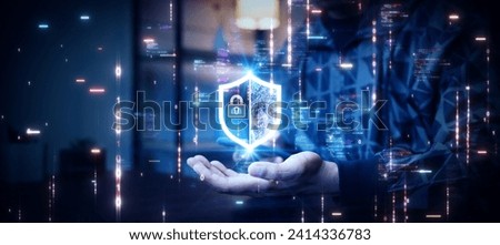 Cybersecurity technology concept protecting personal data software applications. Person using smartphone with shield on hand abstract binary code dark blue background.