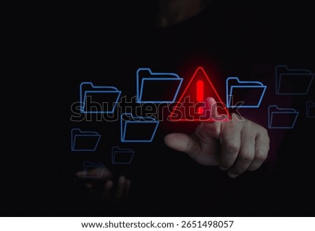 Cybersecurity technology warning alert with hand touching digital folder on laptop computer in cyberspace for cyber threat prevention and sensitive data security. Secure file management safety system.