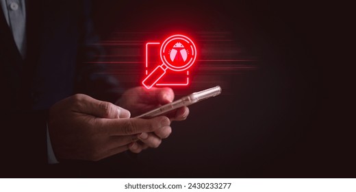 cybersecurity threat analysis concept. Businessman using smartphone with a virtual magnifying glass focusing on a digital bug or virus.