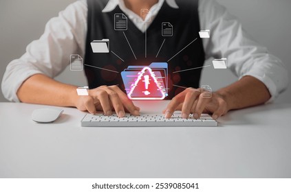 Cybersecurity Warning Alert on document management. Person typing on a keyboard with a red cybersecurity warning symbol displayed, indicating potential data breach or system error. - Powered by Shutterstock - Get 15% off with code: PIKWIZARD15