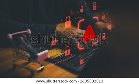 Cybersecurity warning concept with hacker using laptop and credit card, symbolizing online fraud, data theft, phishing, and e-commerce payment security risks in digital financial transactions.
