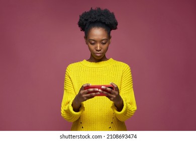 Cybersport Gamer African American Young Girl Playing Mobile Game On Smart Phone On Pink Studio Background