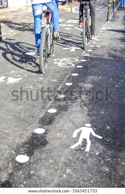 cycle path and next\
to the pedestrian track