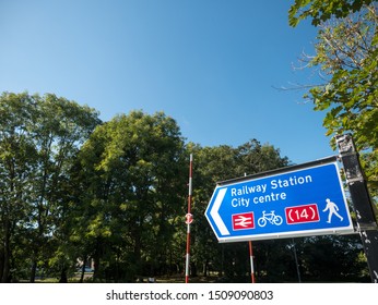 Cycle Road Sigh To Railway Station And City In Environment