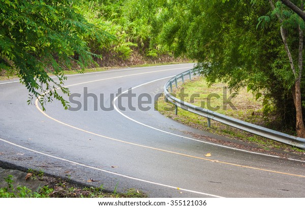 A cycle route\
on forest, Chiangrai,\
Thailand.