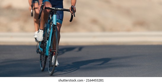 Cycling competition, cyclist athletes riding a race at high speed. Cycling sport triathletes womens biking on triathlon bike - Shutterstock ID 2164455281