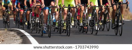 Cycling competition,cyclist athletes riding a race, the peloton climbing the mountain Stock photo © 