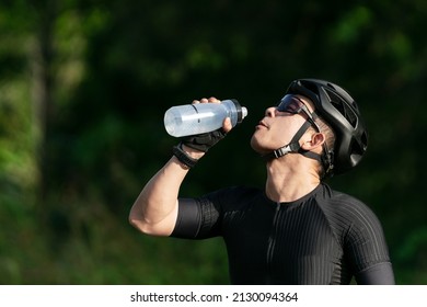 cycling drink water after ride bicycle on street, road, with high speed for exercise hobby and competition in professional tour