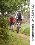 Cycling, fitness and sports friends in nature for marathon, race and journey with competition or training on path. People or cyclist on bicycle in woods, forest or mountains for exercise and cardio