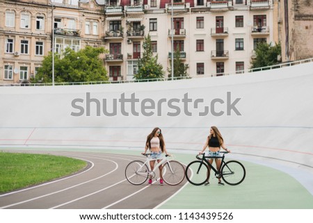 Similar – Happy young people walking along road in summer day