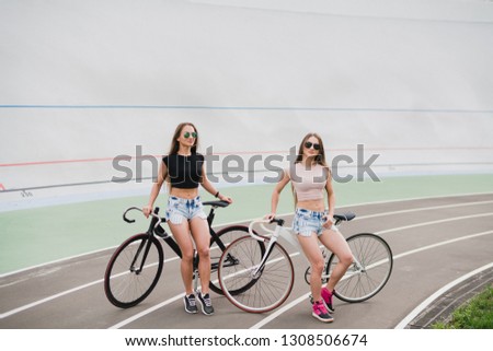 Similar – Happy young people having fun with skateboard and bicycle