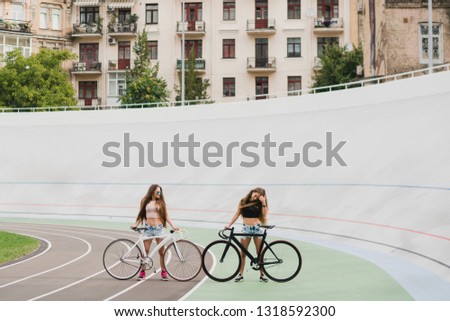 Similar – Happy young people having fun with skateboard and bicycle