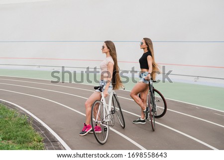 Similar – Happy young people walking along road in summer day