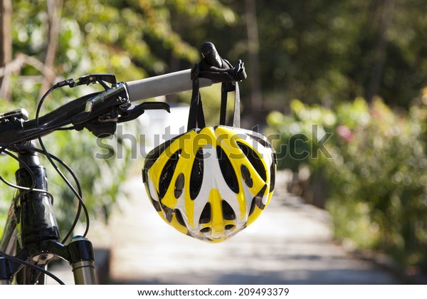 cycling helmet closeup\
on bicycle outdoors