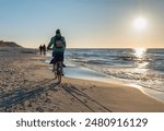 Cycling on the coast during sunset, Karwia Poland. Jazda na rowerze po wybrzeżu podczas zachodu słońca, Karwia Polska